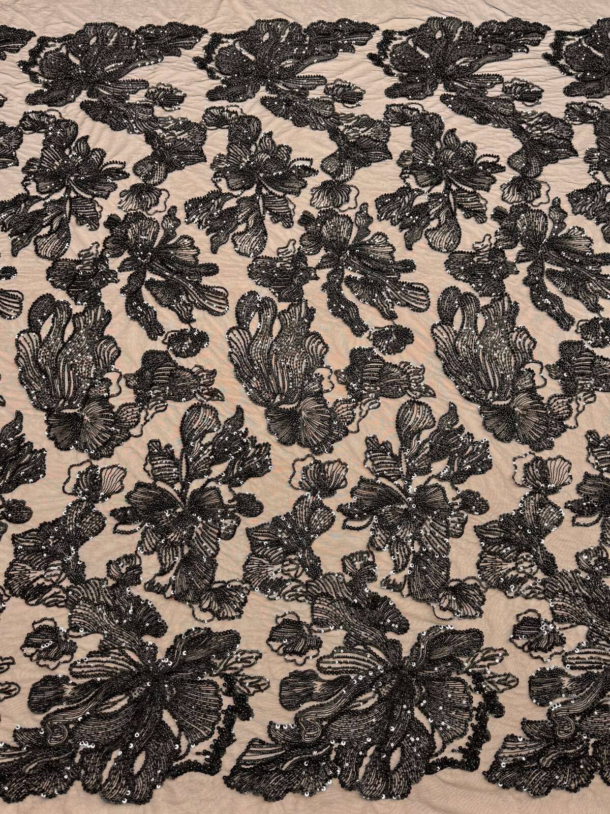 Black beaded couture lace with floral motif on soft tulle