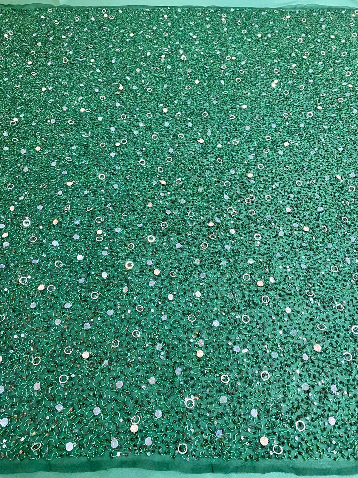 Emerald-green haute-couture lace, beaded