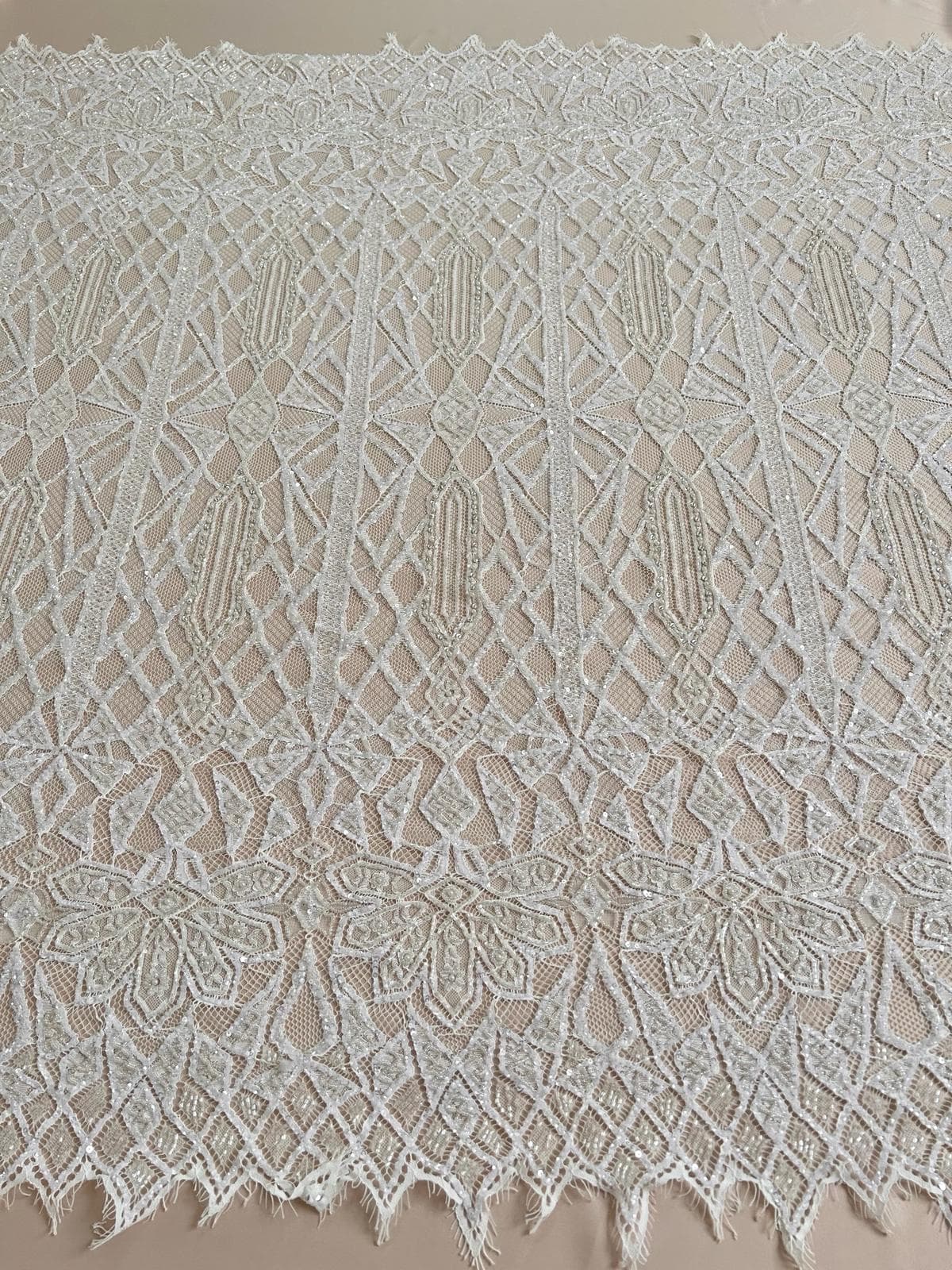 Ivory chantilly-type haute-couture lace, finely beaded