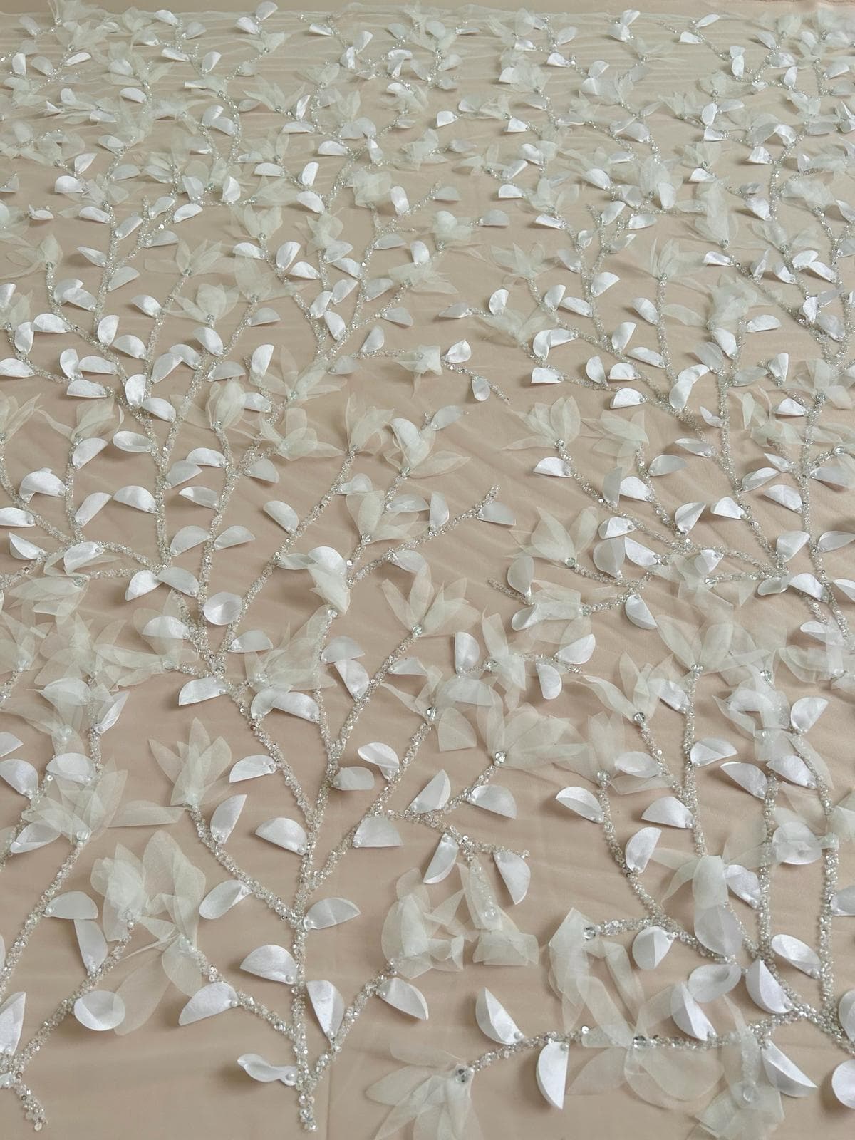 Ivory haute-couture lace with three-dimensional flowers