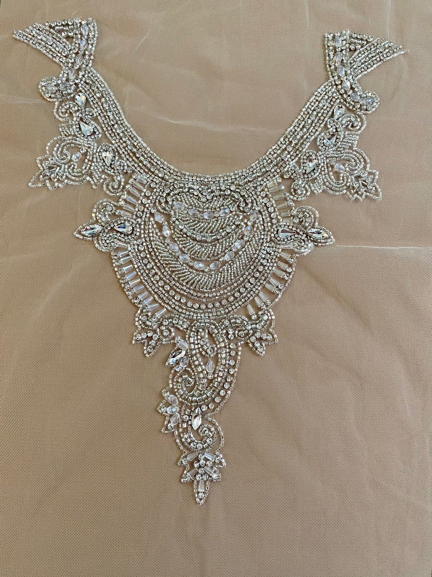 Silver haute-couture panel on nude tulle