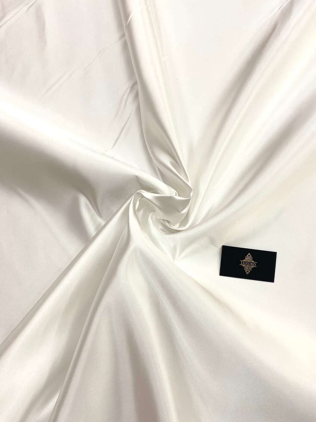 Ivory duchesse taffeta, softly folded