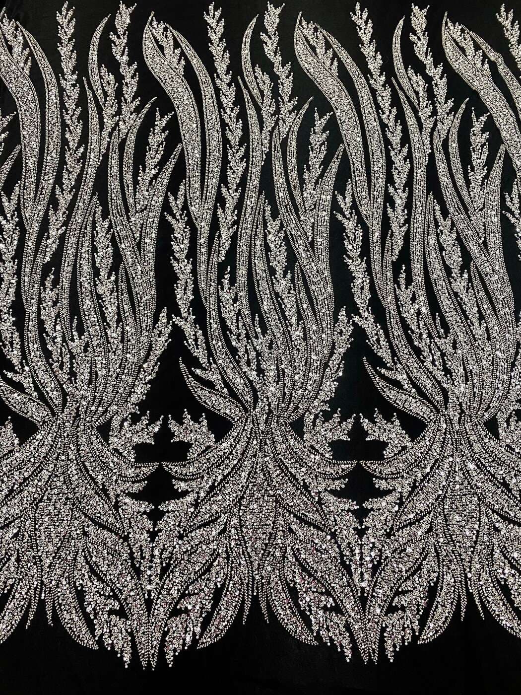 Silver panelled couture lace with plume motifs on black tulle