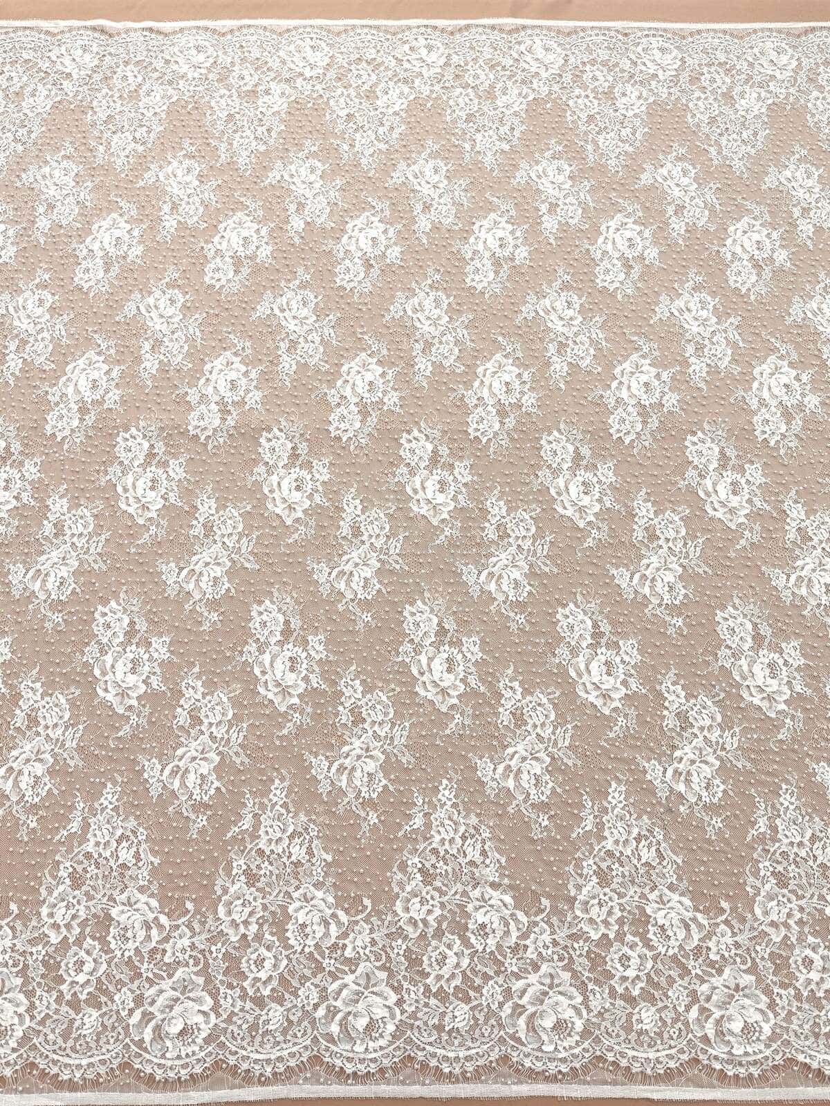 Ivory chantilly lace with fine floral pattern and scalloped edge