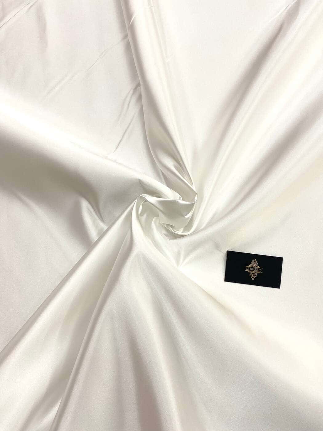 Ivory duchesse taffeta, softly folded