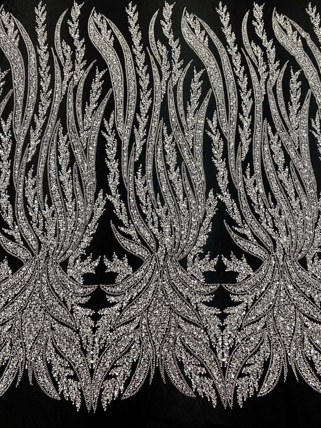 Silver panelled couture lace with plume motifs on black tulle